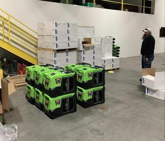 a warehouse wtih green equipment 